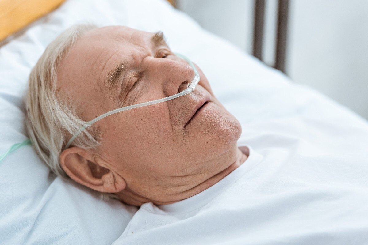 senior unconscious patient with nasal cannula in hospital; Shutterstock ID 1406231168; Business Unit: Jones & Bartlett Learning; Project Name: ATI Fundamentals; ISBN or Project Number: ATI FUND; Element Number: Multiple images in Lesson-31, 32 & 34