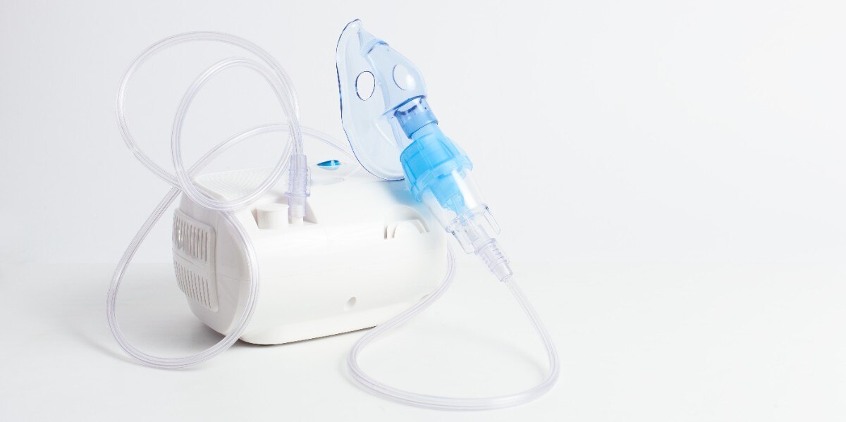 Medical equipment for inhalation with respiratory mask, nebulizer on a white background. Respiratory medicine. Asthma breathing treatment. Bronchitis, asthmatic health equipment; Shutterstock ID 1424031269; Business Unit: Jones & Bartlett Learning; Project Name: ATI Fundamentals; ISBN or Project Number: ATI FUND; Element Number: Multiple images in Lesson-31, 32 & 34